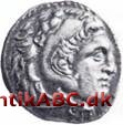Navnet på en antik græsk sølvmønt samt en vægtstandard, der den dag i dag bruges af mange lande