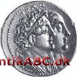 Antik græsk mønt med en værdi af 8 drakmer. Var især udbredt i det makedonske område