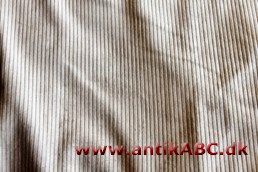  vævet stof med nopper eller hår som står frem fra glat eller kipret grundvæv