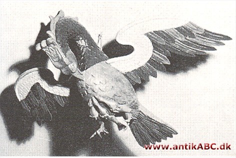 pelikan, middelalderligt symbol for opofrende kærlighed, fordi pelikanen efter Fysiologus hakkede hul på sit eget bryst for at nære sine unger med eget blod